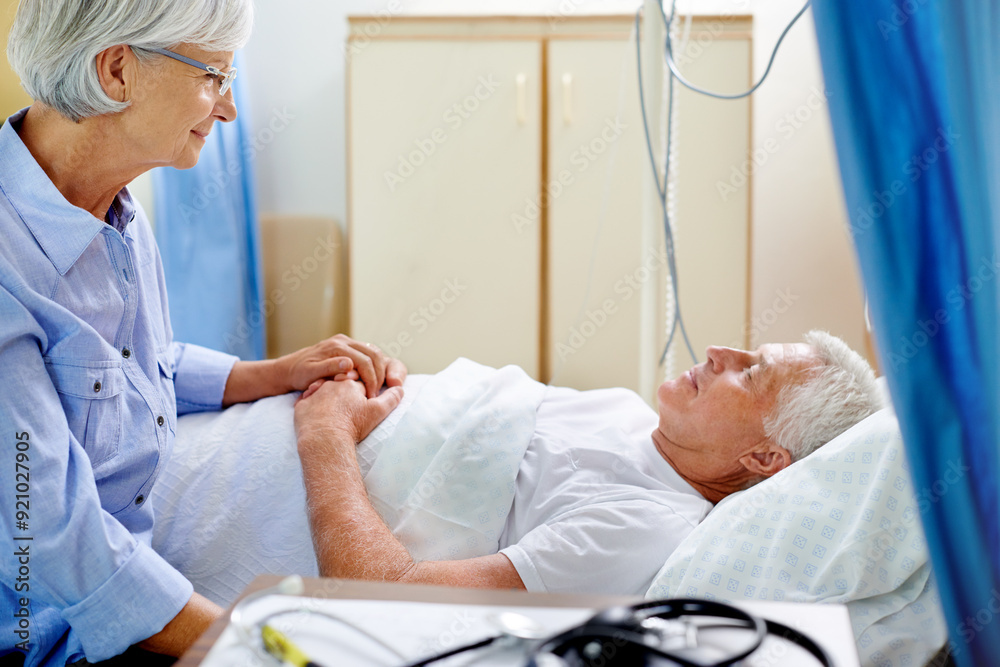 Wall mural Hospital, bed and old man with wife, love and senior care with health insurance, holding hands and smile. Couple, talking and healthcare for elderly person, medical and sick in clinic and illness