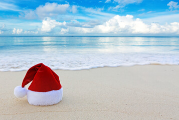 Merry Christmas with Santa hat on the tropical beach