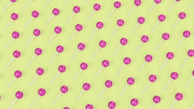 Many rows of pink lollipops