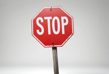 Obraz premium A stop sign on an isolated flat white background.