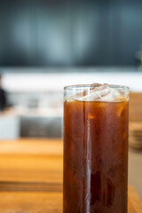 Iced black coffee in a tall glass. Cold summer drink