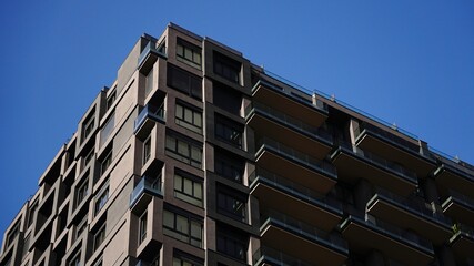 corner of apartment building facade against the sky
