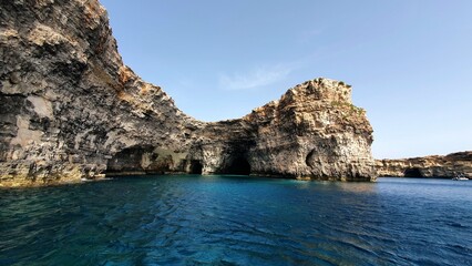 Sea Cave Cliff on Comino Island, Malta with Crystal Clear Blue Waters