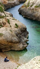 Tranquil Moment at Wied il-Għasri, Gozo - Secluded Cove with Clear Waters