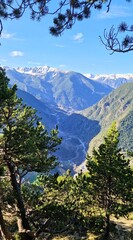 Framed Mountain View of Andorra's Scenic Landscape - Pine Trees and Snow-Capped Peaks