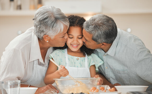 Baking, kiss and grandparents with girl in kitchen with ingredients for cake, cupcakes and dessert. Family, home and happy grandpa, grandma and child embrace for bonding, relationship and learning