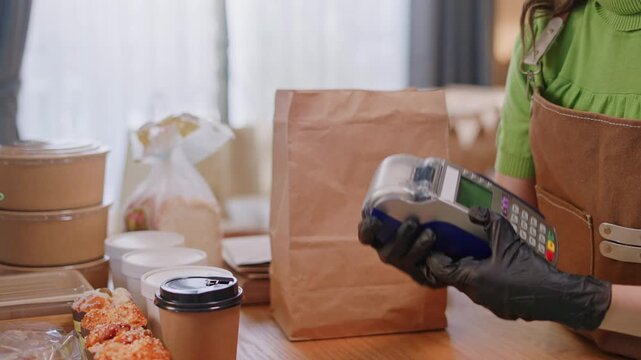 Woman Using Mobile Phone Payment to Transfer Money to bakery Shop Seller.NFC QR code device,payWave,contactless payment code for fast digital transaction,Online banking app on mobile phone,paperless