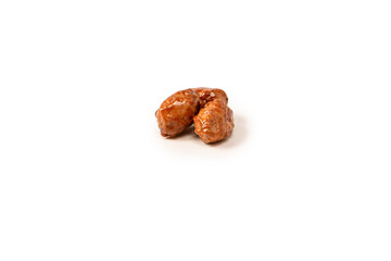 Tasty sweet roasted peanuts isolated on a white background.