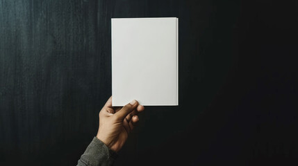 Naklejka premium hand holding blank page, plank brochure flyer