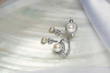 Elegant jewelry set with gemstone. Product still life. Ring, necklace, earrings.