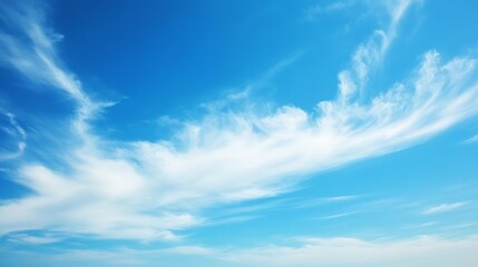 Fototapeta premium Serene Blue Sky with Wispy Clouds
