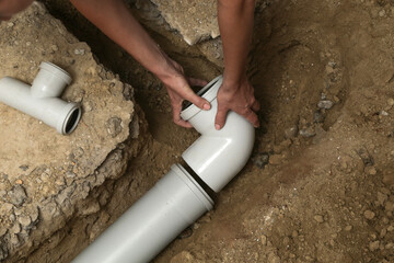 Process of installing PVC pipes sewage system in bathroom, DIY home renovation 