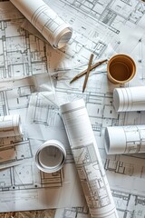 Architectural Blueprints with Tools and a Cup