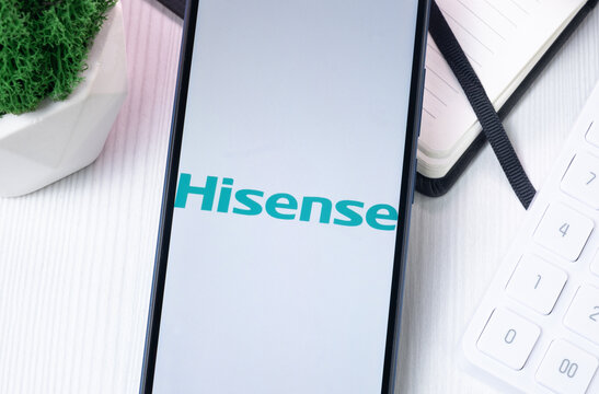 New York, USA - 10 August 2024: Hisense Visual Technology Logo on Phone Screen, Company Icon on Display