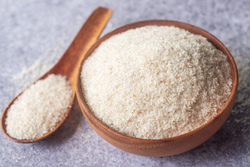 spyllium husk in wooden bowl, healthy eating supplements and superfood