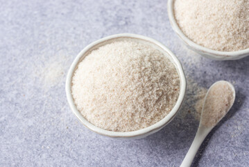 spyllium husk in white ceramic  bowl, healthy eating supplements and superfood