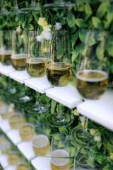 Champagne glasses on decorative shelves, wedding decoration