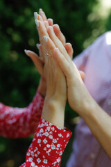 The lovers hold hands, no faces visible.