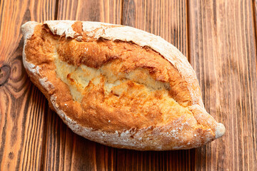 Loaf of  wheat hearth bread . Top view