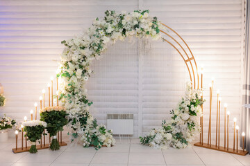 Wedding ara decorated with flowers and artificial candles. © Denys
