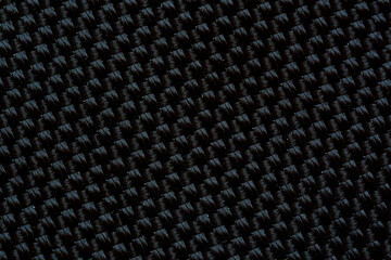 Close-up macro black fabric texture,Black fabric texture with holes macro close up view,Macro of a speakers mashwork textured in black.