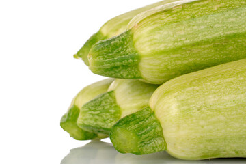 Several ripe zucchini, macro, isolated on white background.