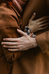 The hands of the newlyweds, the gentle touches, the golden rings.