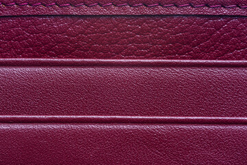Fototapeta premium Red macro leather texture,Texture of artificial leather scarlet color,Leather samples with stitches