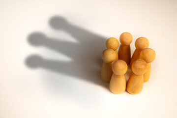 Crown-shaped shadow on a chess pawn circle