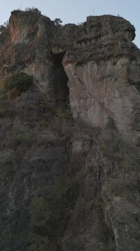 Vertical drone video. Rock formations, forested mountains and large formations. Hiking through the green forest. Hiking concept. Amatlan, Mexico
