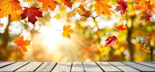Autumn leaves fall in a warm autumn light, with wooden planks in the foreground.  Perfect for fall themes, nature, and product displays.