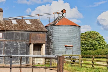 old farm house in the countryside and silos in Brafferton, UK © Robert