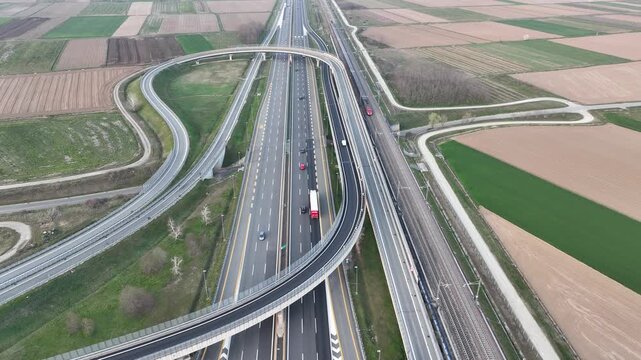 Bird's eye view of the Milan-Turin motorway with the high-speed railway line beside.