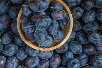 Plum variety Hungarian. Fruit harvest on the table in the kitchen. Autumn blue plum. Vitamin food...