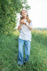Fototapeta premium A child with headphones listening to music and dancing