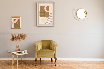 Stylish and luxury living room of apartment interior with elegant green armchair, retro table with flowers and chic accessories