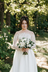 young girl bride in spring garden