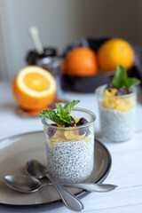 Chia pudding on white wooden table. 