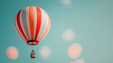 Obraz premium Colorful Hot Air Balloon Floating Against Clear Sky