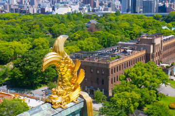 Osaka Castle Shachihoko (sea monster) on main keep roof. Osaka Castle is a Japanese castle in Chuo...