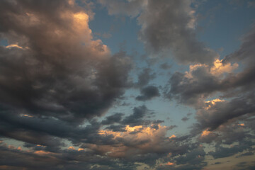 Cloudscape, Colored Clouds at Sunset near the Ocean in a Cloudy Day