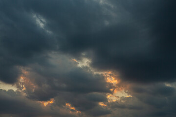 Cloudscape, Colored Clouds at Sunset near the Ocean in a Cloudy Day
