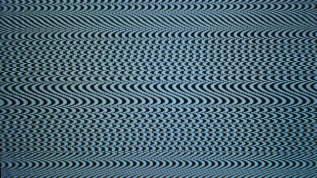 Close-up of analog TV screen with a moire pattern.
