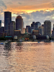 Fototapeta premium Sunset city skyline from the sea - Boston, MA