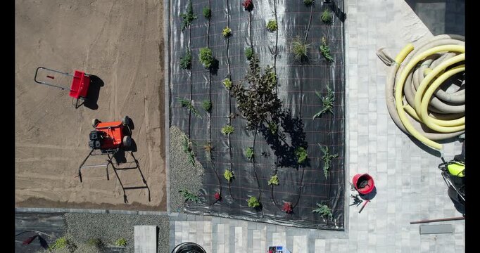 Landscaping Project in Progress at Residential Property With Paving and Planting Details. Weed barier protection and rocks.