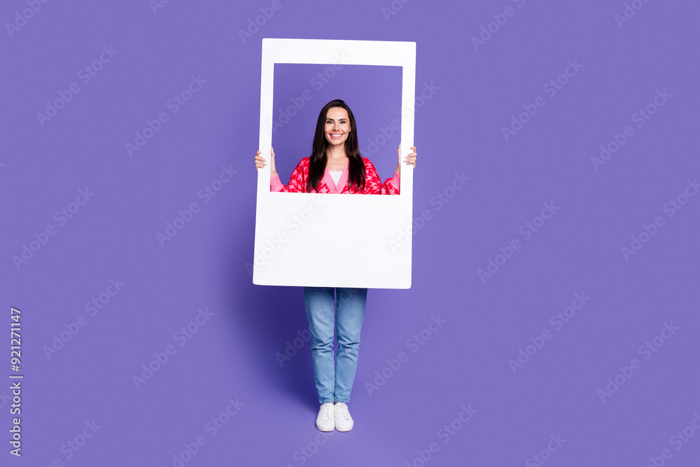 Sticker Full length photo of cheerful pretty lady dressed pink cardigan holding paper photo frame empty space isolated violet color background