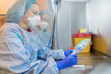 pharmacist preparing high risk chemotherapy medicine for oncology, cancer patient. pharmacists...