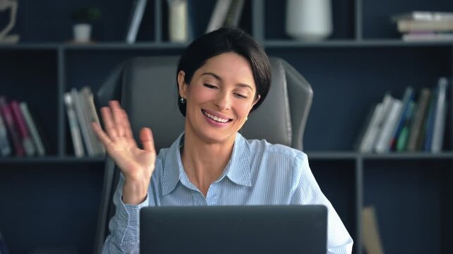Engaging woman in virtual meeting from home office
