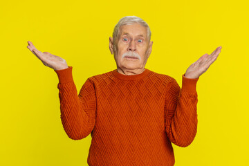 What. Why. Angry senior man raising hands in indignant expression, asking reason of failure...