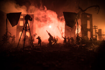 Action (War) movie concept. Military fighting silhouettes in destroyed city. Selective focus